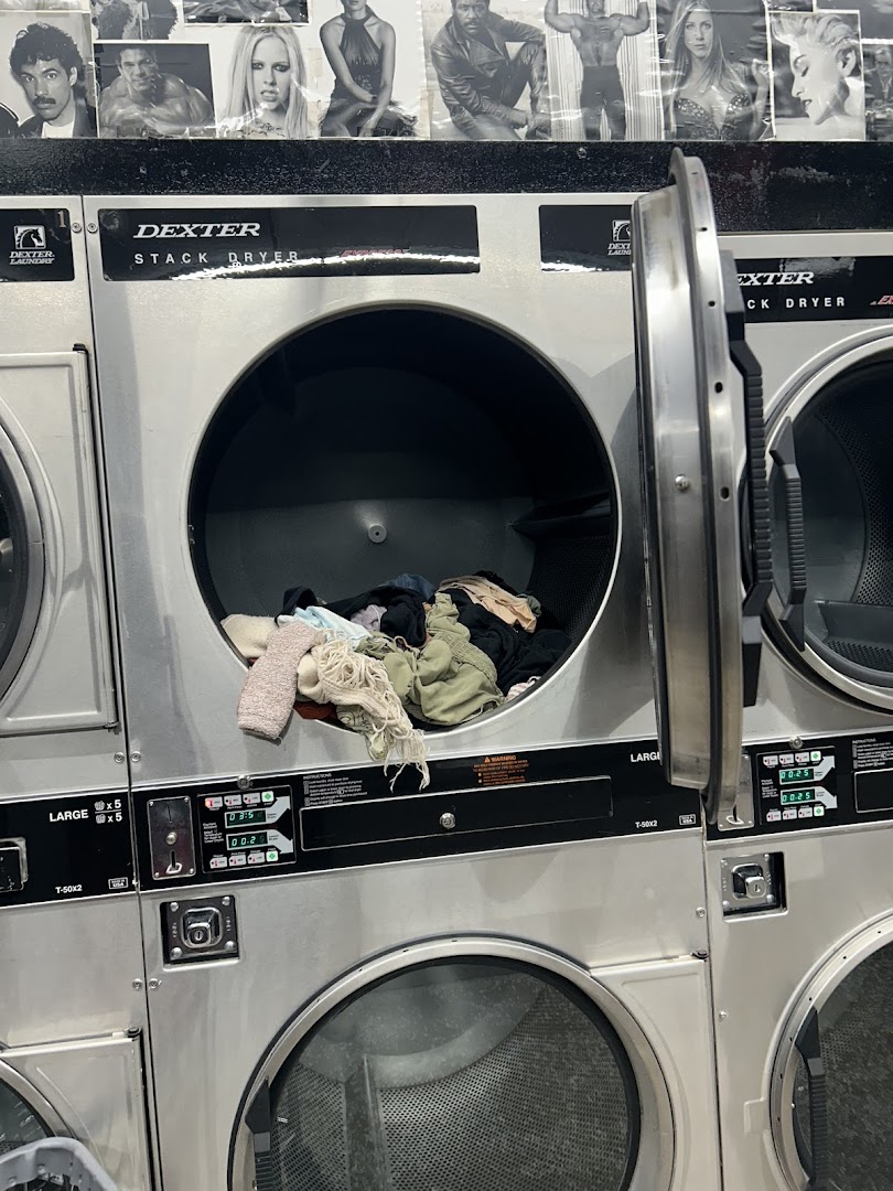 Dexter stack dryers with laundry inside at the laundromat